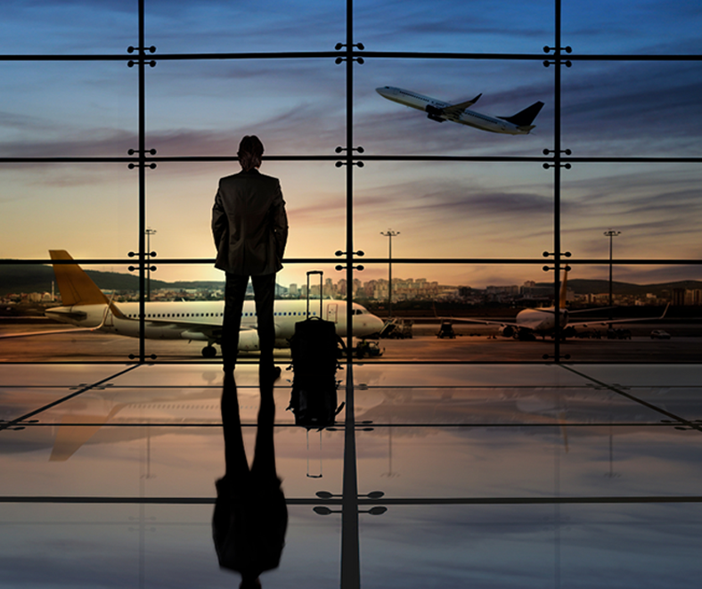 Photo of a man at an airport staring out of a window watching a plane take off. Click to be taken to normal TDY travel. Photo of a man at an airport staring out of a window watching a plane take off. Click to be taken to normal TDY travel.
